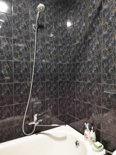 a bathroom with a shower and a sink at The good stay in Šiauliai