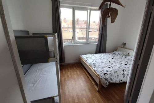 Postel nebo postele na pokoji v ubytování TOK TOK S4 Appartement 1Ch Cosy en plein cœur de Seclin