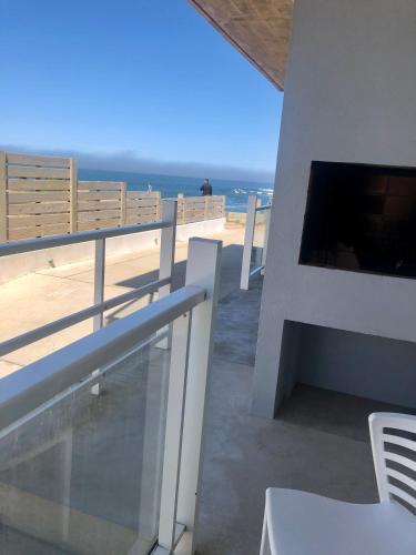 a balcony with a view of the ocean at Las Olas Aparts in La Paloma