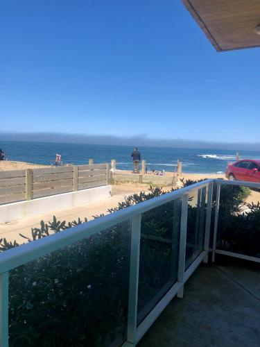 a view of the beach from the balcony of a house at Las Olas Aparts in La Paloma