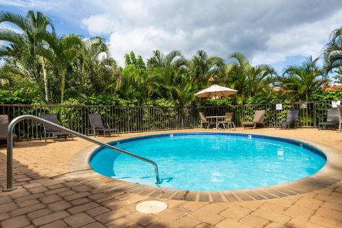 a swimming pool with a metal rail around it at Maui Vista Vacation Condo in Kihei