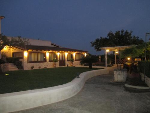 a house with a skateboard ramp in a yard at night at Le Zarafe in Caltabellotta