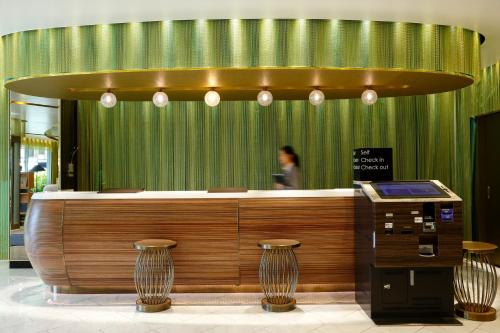 
a person standing in front of a counter top at Kyoto Tower Hotel Annex in Kyoto
