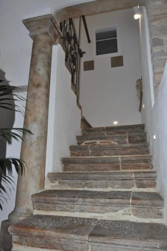 a set of stone stairs in a house at RELAIS SAN MARCO LUXURY GUEST HOUSE in Volturino