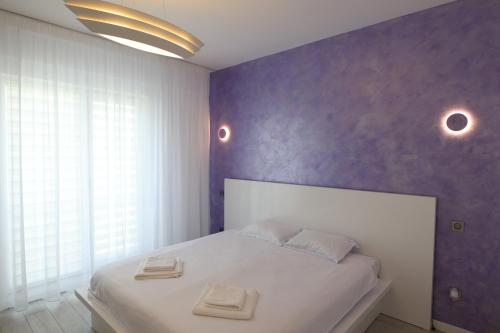 Säng eller sängar i ett rum på Nicho Residence Bucurestii Noi