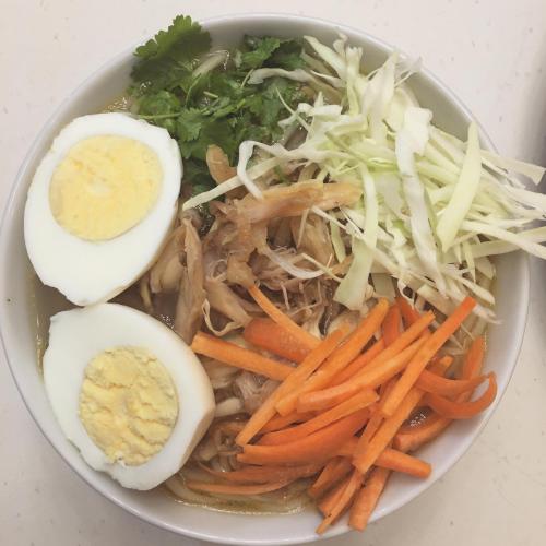 a bowl of food with an egg and carrots at THE GINGKO EYRIE in Kalimpong