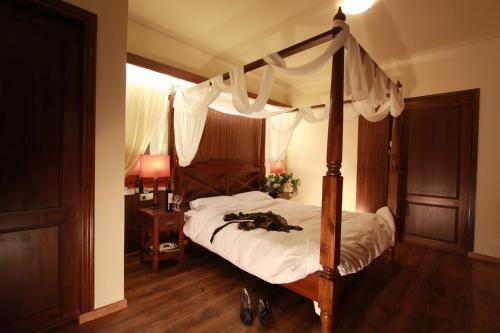 Ένα ή περισσότερα κρεβάτια σε δωμάτιο στο Mythoxenia