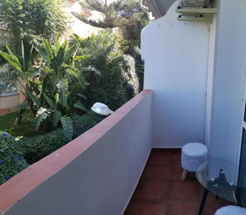 a balcony with a view of a garden at Apartamento Aquila Parque in Fuengirola