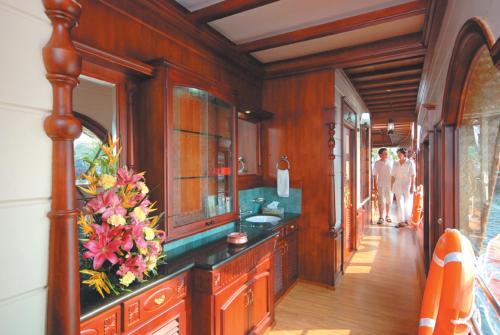 a bathroom with a sink and a mirror at Sterling Houseboats Lake Palace, Alleppey in Alleppey
