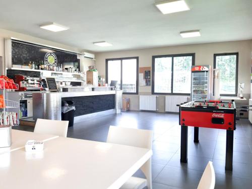 a restaurant with a ping pong table in a room at RipamontiBnB in Milan