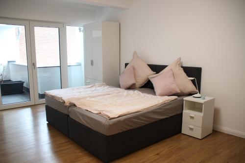 Cama ou camas em um quarto em Am Kronengarten
