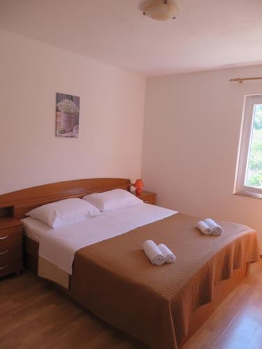 Postel nebo postele na pokoji v ubytování Holiday home Marija i Lucija