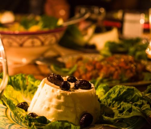 a piece of food on a plate with lettuce at Camp Cameleon in Marrakech