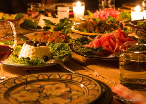 a table full of plates of food on a table at Camp Cameleon in Marrakech