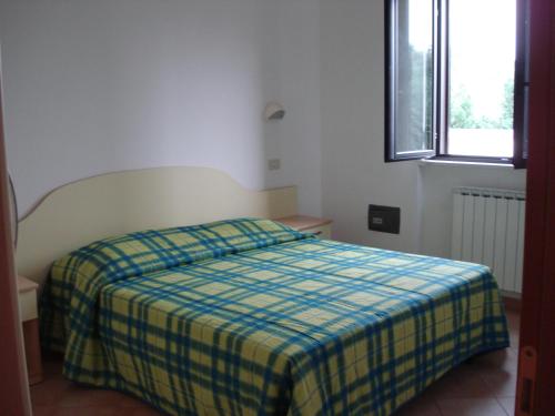 En eller flere senge i et værelse på La Piana Di Calena