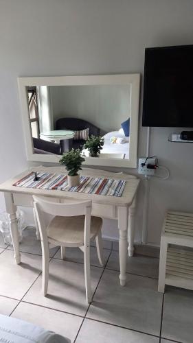 Μια τηλεόραση ή/και κέντρο ψυχαγωγίας στο Harmony Guesthouse