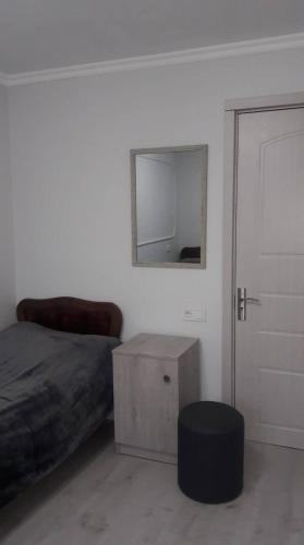 Un ou plusieurs lits dans un hébergement de l'établissement Guesthouse of Manoni Ratiani
