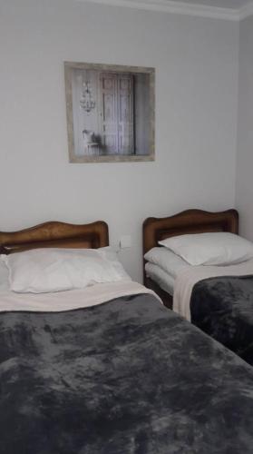 Un ou plusieurs lits dans un hébergement de l'établissement Guesthouse of Manoni Ratiani