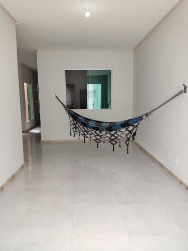 a hammock in the middle of a room at Casa do Lamarques in Piranhas