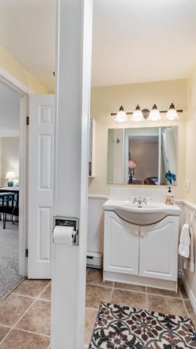 a bathroom with a sink and a mirror at Bayview Pines Country Inn B&B in Mahone Bay