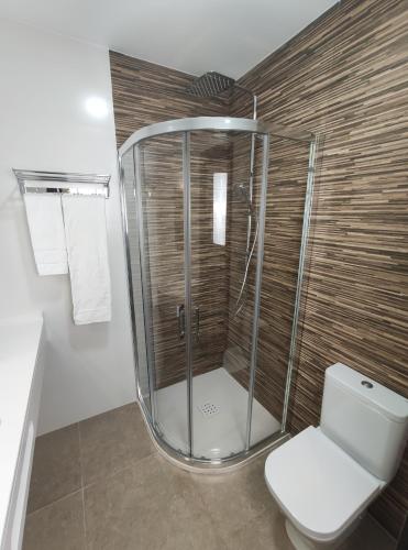 Un baño de Hostal Óleo Auto Check-in