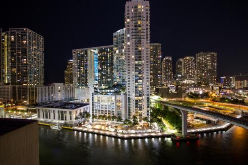 a city skyline at night with a bridge and buildings at Comfort Inn & Suites Downtown Brickell-Port of Miami in Miami