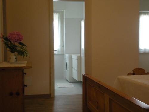 a room with a kitchen with a refrigerator at Villa Ducati in Vattaro