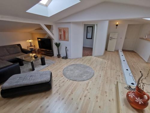 a living room with a couch and a table at Ferienwohnung Alte Feuerwehr in Ueckermünde