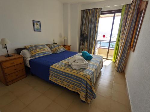 Ένα ή περισσότερα κρεβάτια σε δωμάτιο στο Casa Carulla Blue