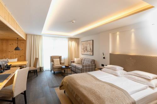 Uma cama ou camas num quarto em Hotel Grünauerhof