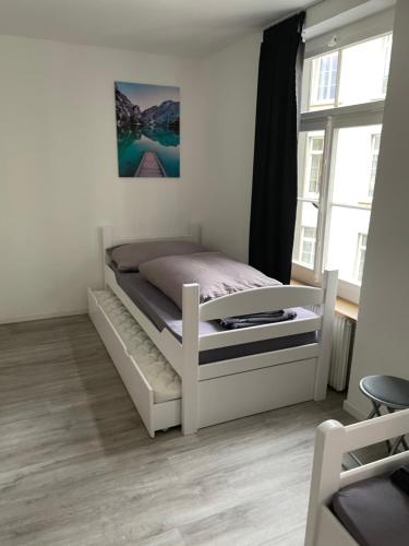 מיטה או מיטות בחדר ב-Haus zur Eiche Private 1 Zimmerstudios