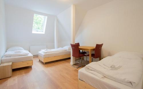 Postel nebo postele na pokoji v ubytování PRIME Apartments - Monteur House with 1-4 Room Apartments