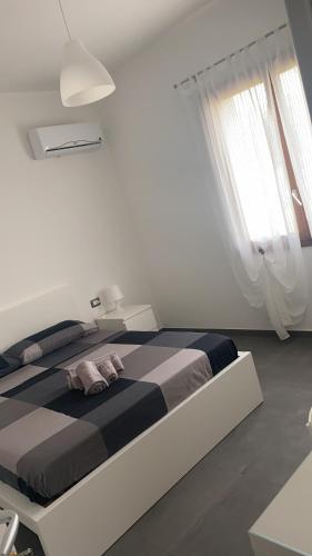 Postel nebo postele na pokoji v ubytování B&B Il Sogno di Mario