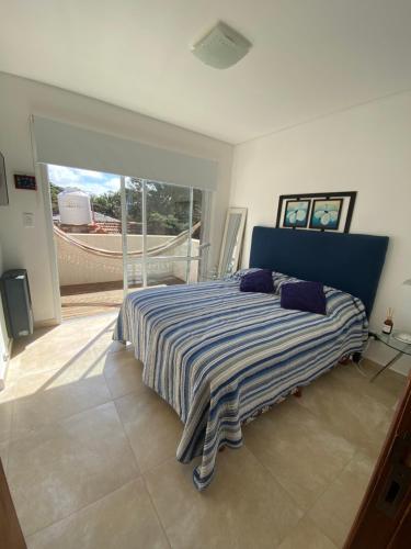 En eller flere senge i et værelse på Hermoso depto Valeria del Mar