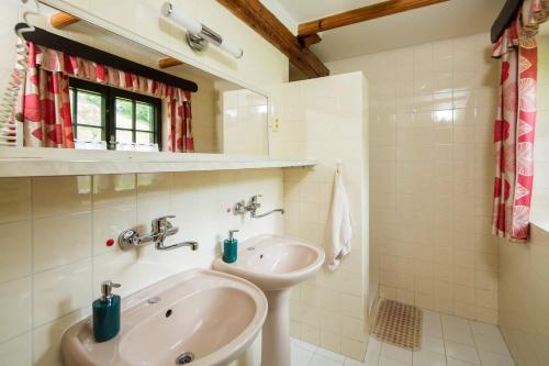 a bathroom with a sink and a bath tub at Penzion U Sovy in Dolný Kubín