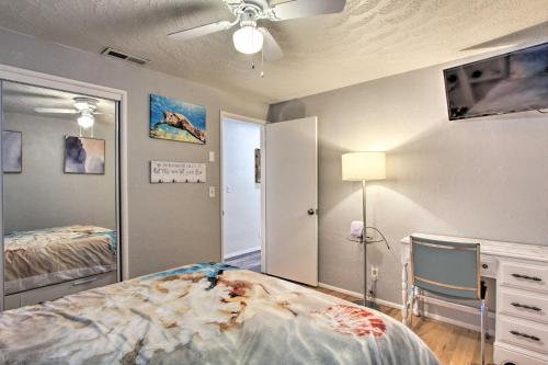 a bedroom with a bed and a ceiling fan at Hot Tub and Theater Room Tropical Springfield Home in Springfield