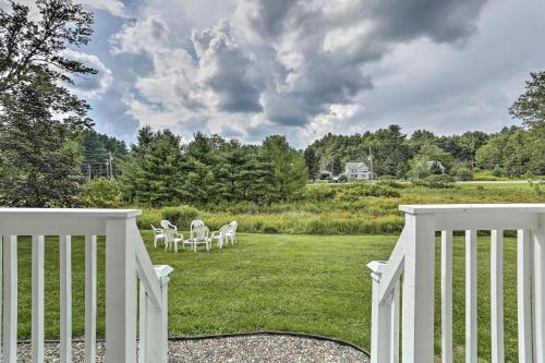 a porch with a white fence and a lawn at Spacious Sullivan County House with Fire Pit in Hurleyville