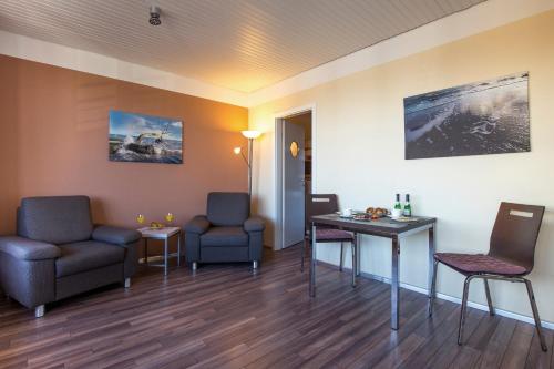 a waiting room in a hospital with chairs and a table at ancora Marina Haus 2 Nr 06, Typ 2 in Neustadt in Holstein