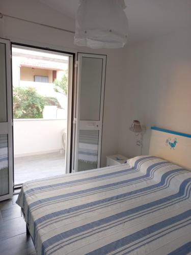 Ένα ή περισσότερα κρεβάτια σε δωμάτιο στο Casa Maria