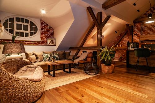 a living room with a couch and a table at Sting Old Town Ostrava in Ostrava