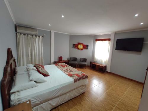 Un pat sau paturi într-o cameră la Hotel Amatista