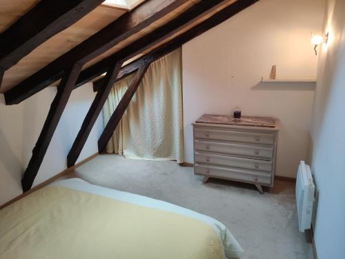 מיטה או מיטות בחדר ב-Maison du Bonheur