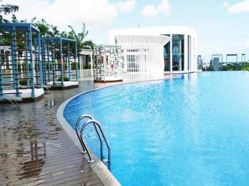 a large swimming pool on top of a building at Zulanie Suite Troika Residence, SPACIOUS AND COZY WITH POOL, Free Wifi & Netflix in Golden Triangle of Kota Bharu in Kota Bharu