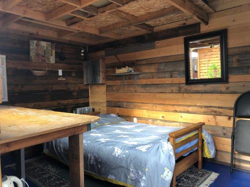 Ένα ή περισσότερα κρεβάτια σε δωμάτιο στο Cabine, Home Sweet Home