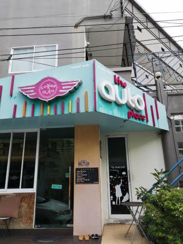 a restaurant with a sign on the front of it at The Auto Place in Ban Sam Kong