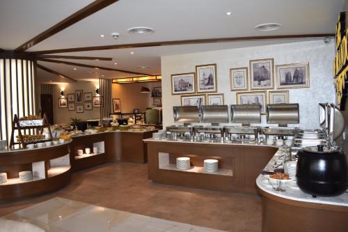 A restaurant or other place to eat at Faletti's Grand Hotel Multan