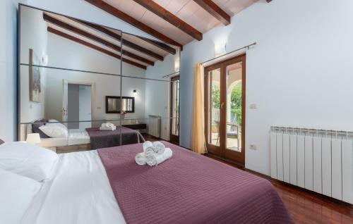 Postel nebo postele na pokoji v ubytování Villa Lucas