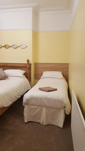 Ένα ή περισσότερα κρεβάτια σε δωμάτιο στο The Beacon Hotel