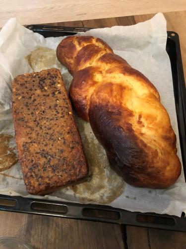two loaves of bread on a tray on a table at L 'Air d'Aspe in Accous