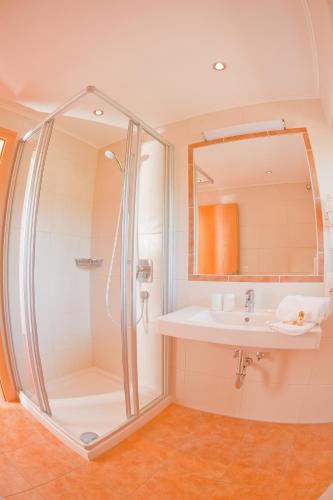a bathroom with a shower and a sink at Sun Valley - Wildschönau in Auffach